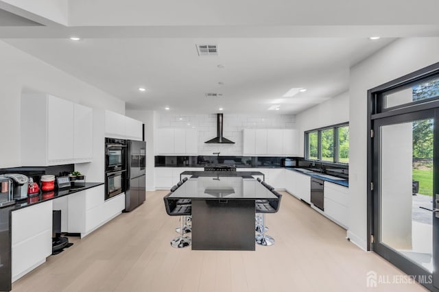 36 School Rd E, Marlboro, NJ 07746 - kitchen with modern cabinets, a breakfast bar, white cabinets, decorative backsplash, and recessed lighting