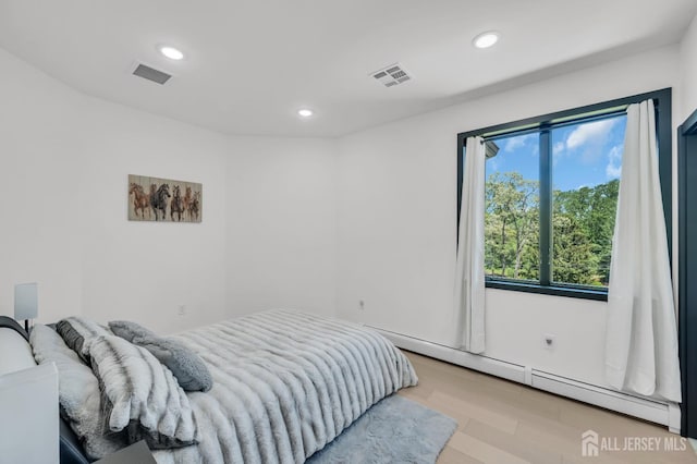 36 School Rd E, Marlboro, NJ 07746 - bedroom with a baseboard radiator, recessed lighting, and wood finished floors