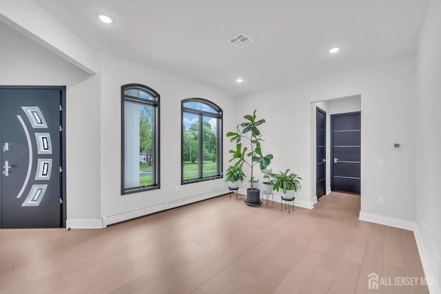 36 School Rd E, Marlboro, NJ 07746 - unfurnished room with a baseboard radiator, wood finished floors, and recessed lighting