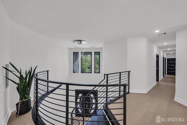 36 School Rd E, Marlboro, NJ 07746 - hall featuring an upstairs landing, recessed lighting, and wood finished floors
