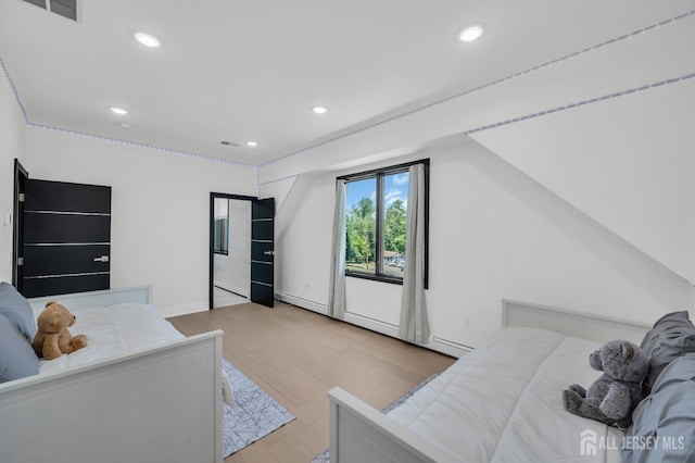 36 School Rd E, Marlboro, NJ 07746 - bedroom featuring wood finished floors, recessed lighting, and a baseboard radiator