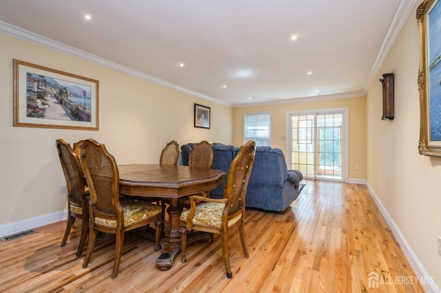 dining space with visible vents, ornamental molding, baseboards, recessed lighting, and light wood finished floors
