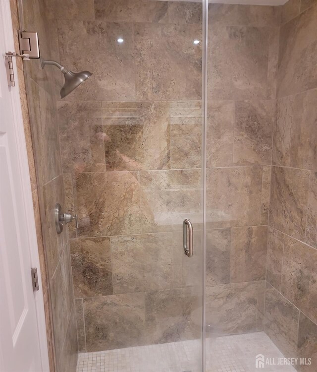 bathroom featuring a shower stall