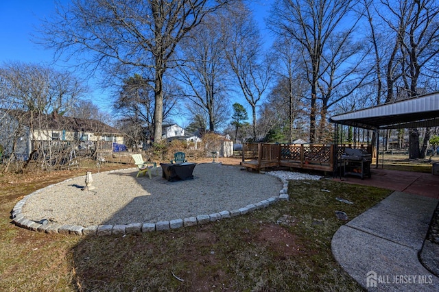 view of yard with a wooden deck