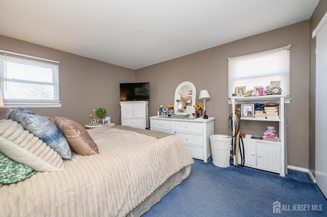 bedroom featuring dark carpet