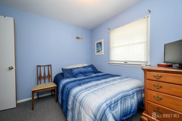 bedroom featuring dark colored carpet