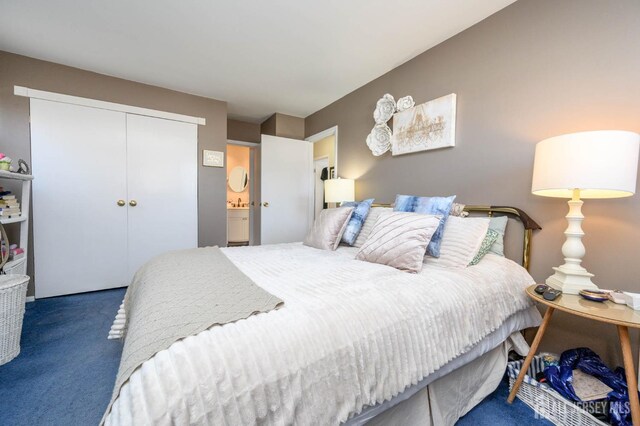 carpeted bedroom featuring a closet