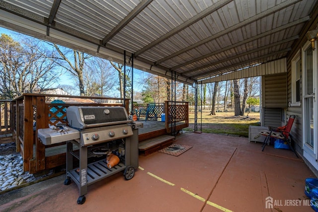 view of patio / terrace with grilling area and a wooden deck