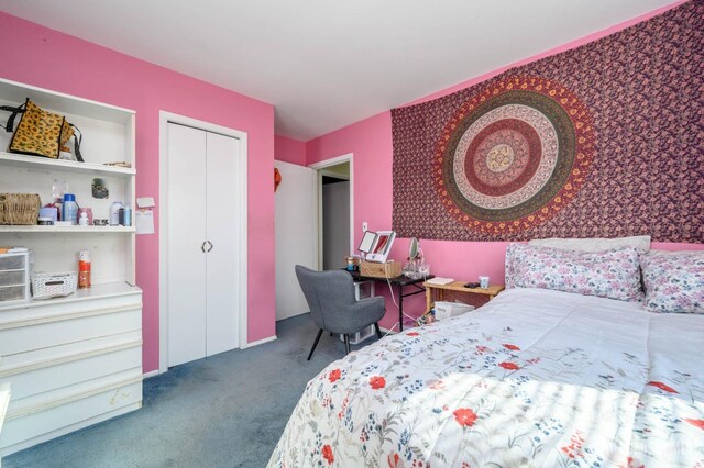 bedroom with a closet and carpet flooring