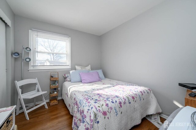 bedroom with hardwood / wood-style flooring