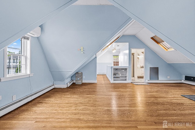 425 Grove Ave, Metuchen, NJ 08840 - additional living space featuring a baseboard heating unit, a skylight, wood finished floors, and vaulted ceiling