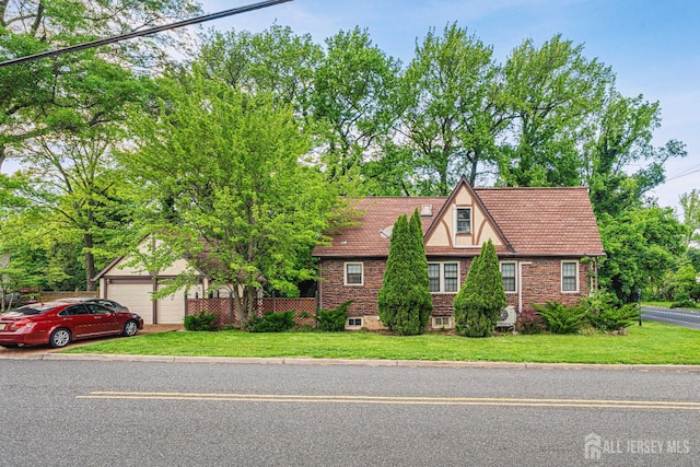 425 Grove Ave, Metuchen, NJ 08840 - tudor-style house with a garage
