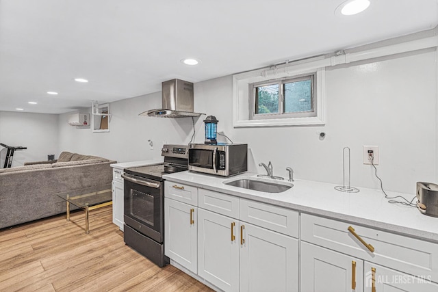 425 Grove Ave, Metuchen, NJ 08840 - kitchen with range with electric cooktop, stainless steel microwave, wall chimney range hood, a sink, and an AC wall unit