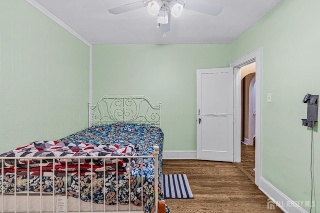 425 Grove Ave, Metuchen, NJ 08840 - bedroom featuring wood finished floors, arched walkways, baseboards, and ceiling fan