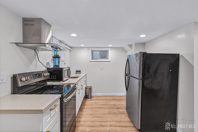 425 Grove Ave, Metuchen, NJ 08840 - kitchen featuring stainless steel appliances, extractor fan, light wood-style floors, white cabinetry, and light countertops