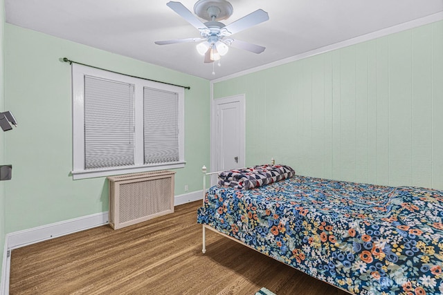 425 Grove Ave, Metuchen, NJ 08840 - bedroom featuring radiator heating unit, wood finished floors, baseboards, and ceiling fan