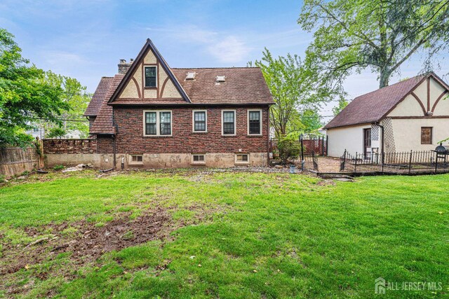 425 Grove Ave, Metuchen, NJ 08840 - back of house featuring a chimney and a fenced backyard