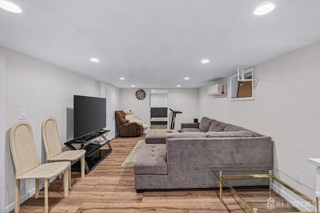 425 Grove Ave, Metuchen, NJ 08840 - living area featuring light wood finished floors, a wall unit AC, recessed lighting, and baseboards