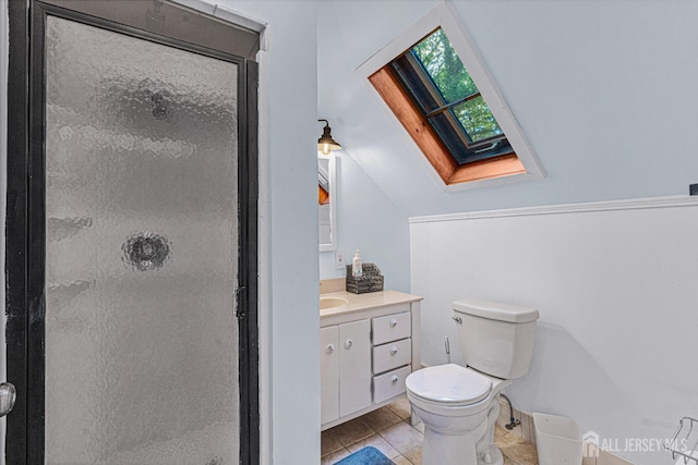 425 Grove Ave, Metuchen, NJ 08840 - bathroom featuring a skylight, vanity, a stall shower, toilet, and tile patterned flooring