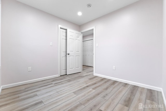 763 Gadek Pl, Perth Amboy, NJ 08861 - unfurnished bedroom featuring baseboards, light wood finished floors, recessed lighting, and a closet
