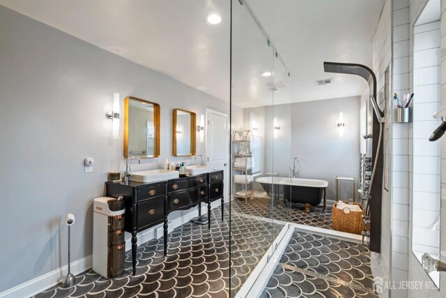 bathroom featuring a bathing tub and vanity