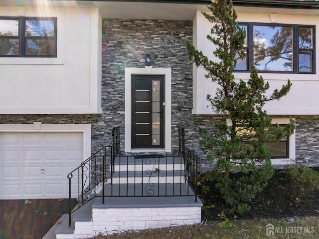 entrance to property featuring a garage