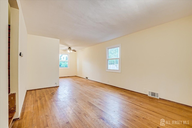 8 Macarthur Dr, Edison, NJ 08837 - spare room with healthy amount of natural light, light wood finished floors, and ceiling fan