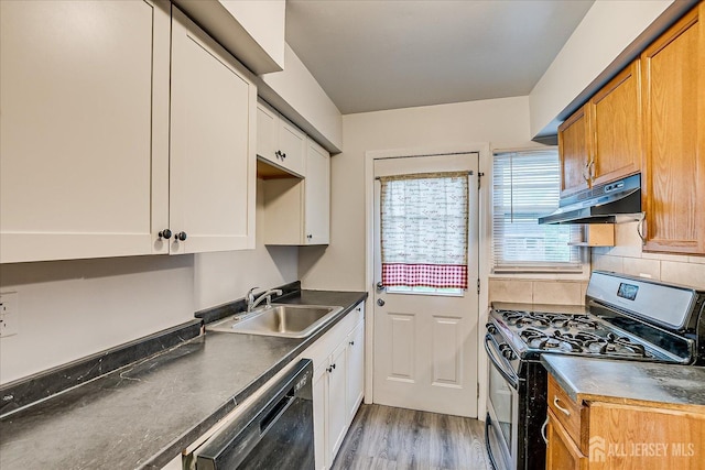 8 Macarthur Dr, Edison, NJ 08837 - kitchen featuring gas stove, a sink, black dishwasher, under cabinet range hood, and light wood-style flooring