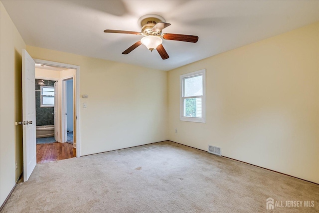 8 Macarthur Dr, Edison, NJ 08837 - carpeted empty room featuring healthy amount of natural light and a ceiling fan