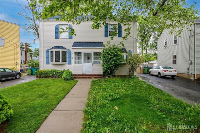 8 Macarthur Dr, Edison, NJ 08837 - view of front facade featuring a front yard and a shingled roof