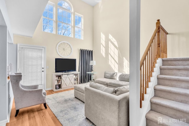 12 Jeremy Way, Old Bridge, NJ 08857 - living area with a high ceiling, wood finished floors, stairway, and baseboards
