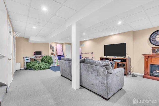 12 Jeremy Way, Old Bridge, NJ 08857 - carpeted living room with a paneled ceiling, baseboards, recessed lighting, and a warm lit fireplace