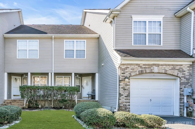12 Jeremy Way, Old Bridge, NJ 08857 - traditional-style house featuring an attached garage, a front yard, and roof with shingles