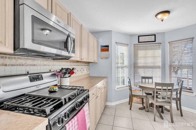 12 Jeremy Way, Old Bridge, NJ 08857 - kitchen with stainless steel appliances, baseboards, decorative backsplash, and healthy amount of natural light