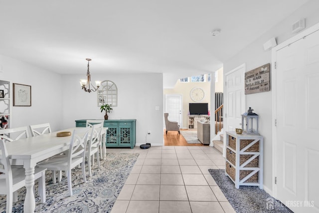 12 Jeremy Way, Old Bridge, NJ 08857 - dining space featuring a chandelier, light tile patterned flooring, and baseboards