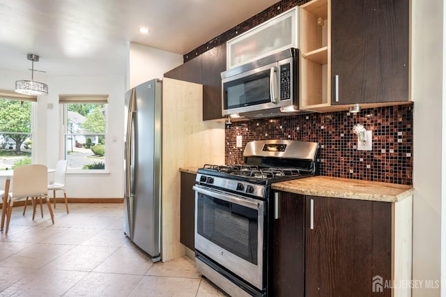 297 Kraemer Ct, East Brunswick, NJ 08816 - kitchen with stainless steel appliances, dark brown cabinets, tasteful backsplash, baseboards, and hanging light fixtures