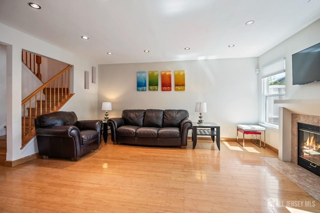 297 Kraemer Ct, East Brunswick, NJ 08816 - living room with a high end fireplace, light wood-style flooring, stairs, recessed lighting, and baseboards