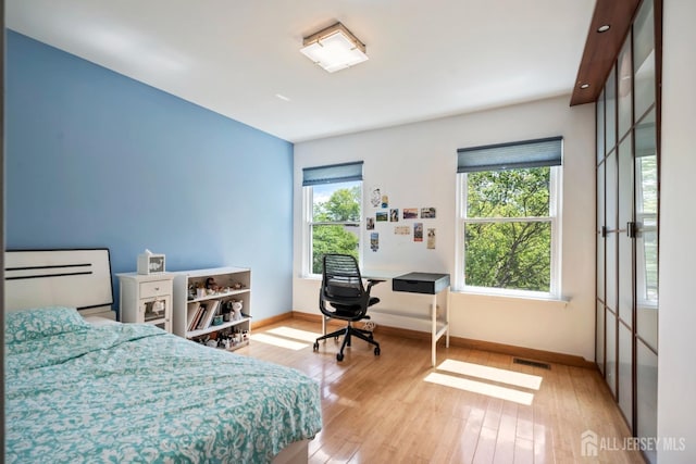 297 Kraemer Ct, East Brunswick, NJ 08816 - bedroom featuring baseboards and hardwood / wood-style floors