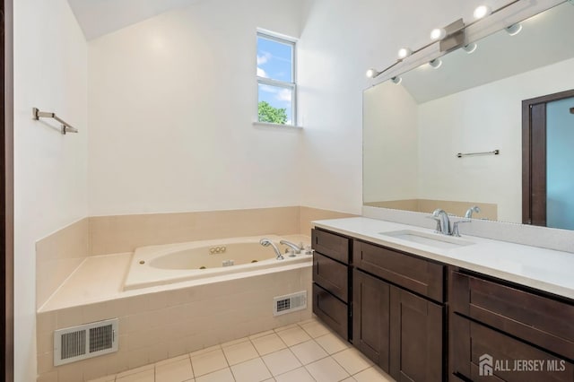 297 Kraemer Ct, East Brunswick, NJ 08816 - bathroom featuring a jetted tub, tile patterned flooring, and vanity