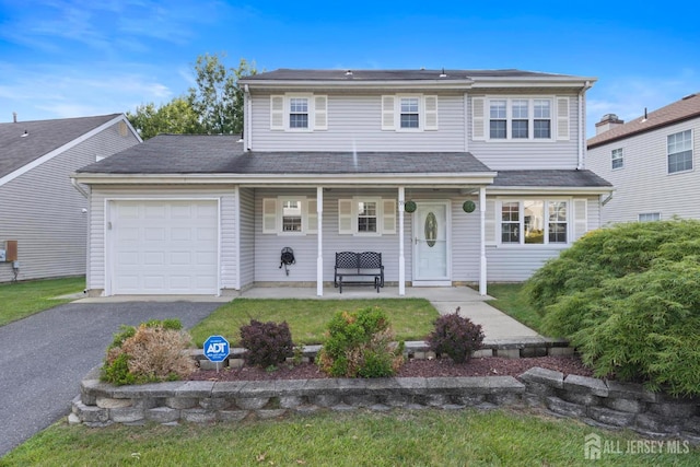 55 Nottingham Dr, Old Bridge, NJ 08857 - traditional-style house featuring an attached garage, a porch, and driveway