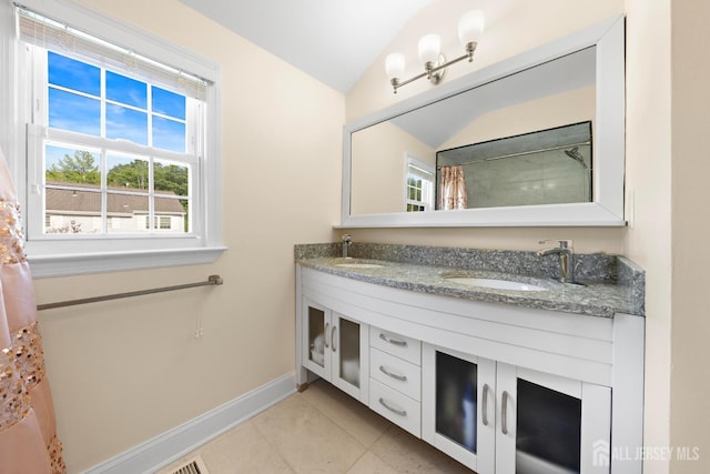 55 Nottingham Dr, Old Bridge, NJ 08857 - bathroom with double vanity, tile patterned flooring, and lofted ceiling