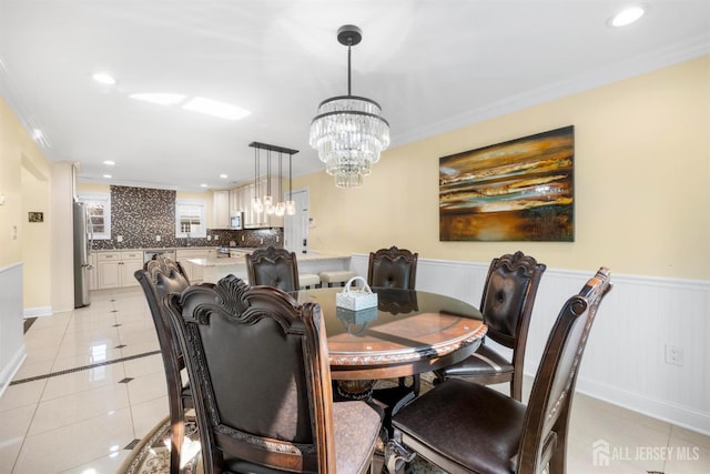 55 Nottingham Dr, Old Bridge, NJ 08857 - dining area featuring a chandelier, a wainscoted wall, light tile patterned floors, recessed lighting, and crown molding
