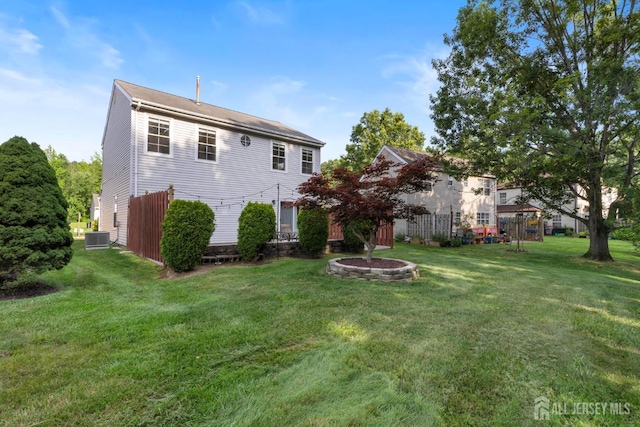 55 Nottingham Dr, Old Bridge, NJ 08857 - back of property featuring a lawn