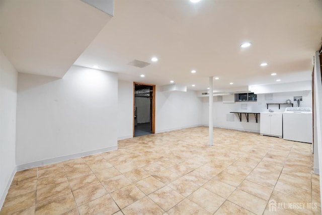 299 Riva Ave, East Brunswick, NJ 08850 - finished below grade area with recessed lighting, washing machine and dryer, light tile patterned floors, and baseboards