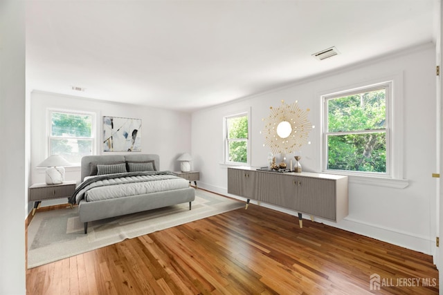 299 Riva Ave, East Brunswick, NJ 08850 - bedroom featuring wood finished floors, baseboards, and crown molding