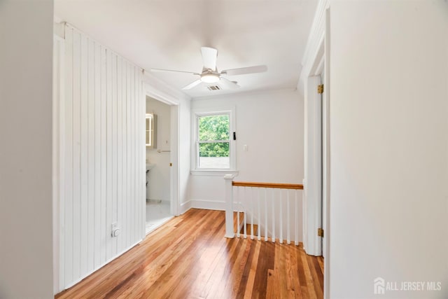 299 Riva Ave, East Brunswick, NJ 08850 - empty room with light wood-style flooring, ceiling fan, and ornamental molding