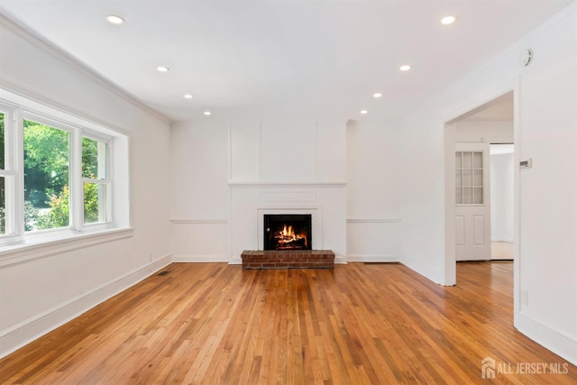 299 Riva Ave, East Brunswick, NJ 08850 - unfurnished living room featuring light wood-type flooring, recessed lighting, and a fireplace