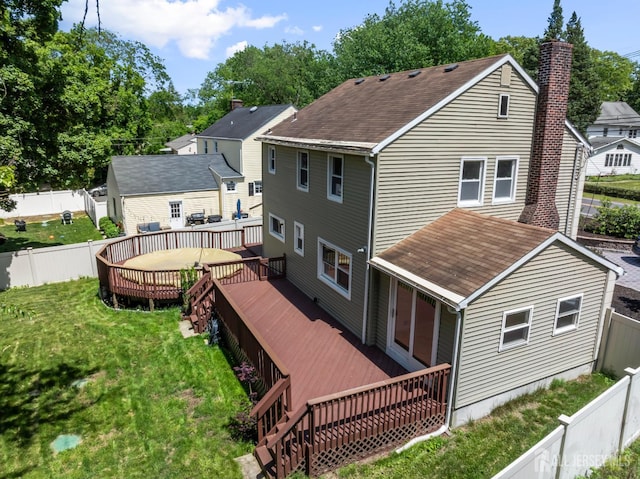 299 Riva Ave, East Brunswick, NJ 08850 - back of house featuring a wooden deck, roof with shingles, and a chimney