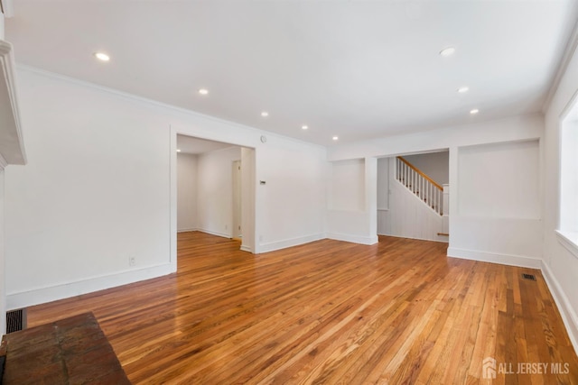 299 Riva Ave, East Brunswick, NJ 08850 - unfurnished room featuring light wood-type flooring, recessed lighting, stairway, baseboards, and ornamental molding