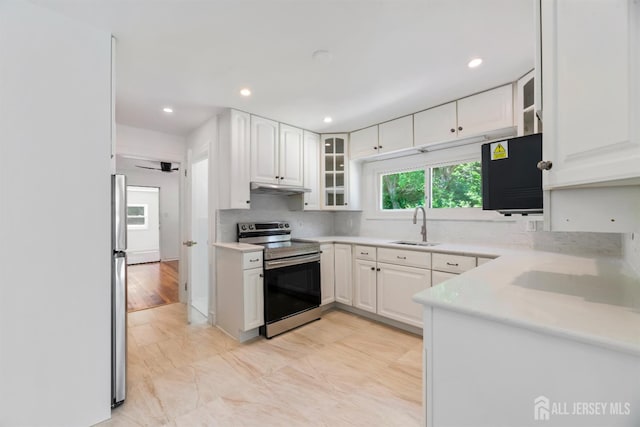 299 Riva Ave, East Brunswick, NJ 08850 - kitchen featuring electric range, a sink, under cabinet range hood, glass insert cabinets, and white cabinetry